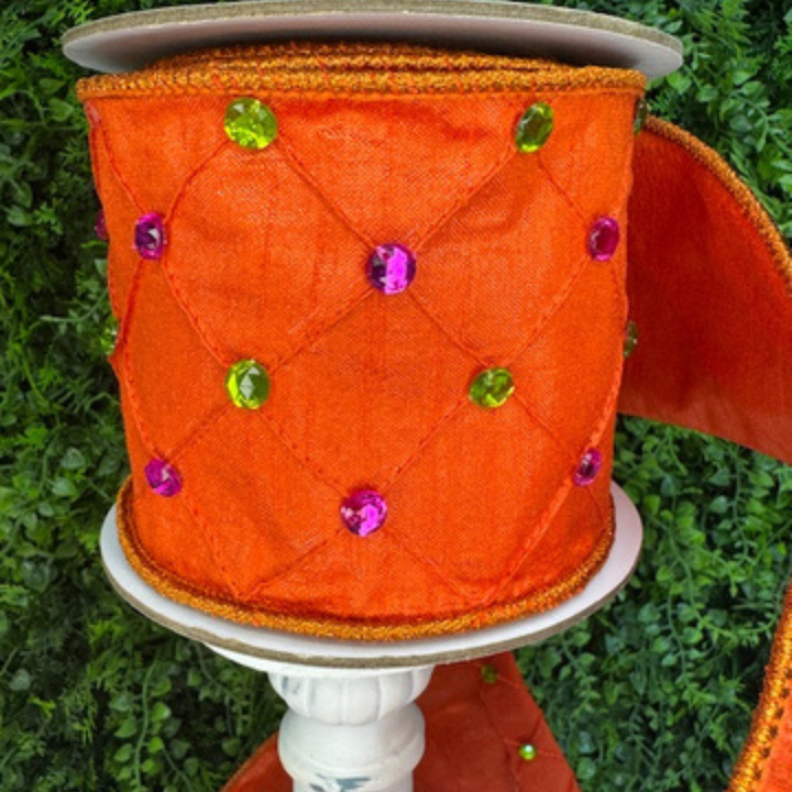 Farrisilk Jeweled orange wired ribbon with quilted texture and pink and green gem acccents. wired edge designer ribbon for Fall wreaths and Halloween decor.
