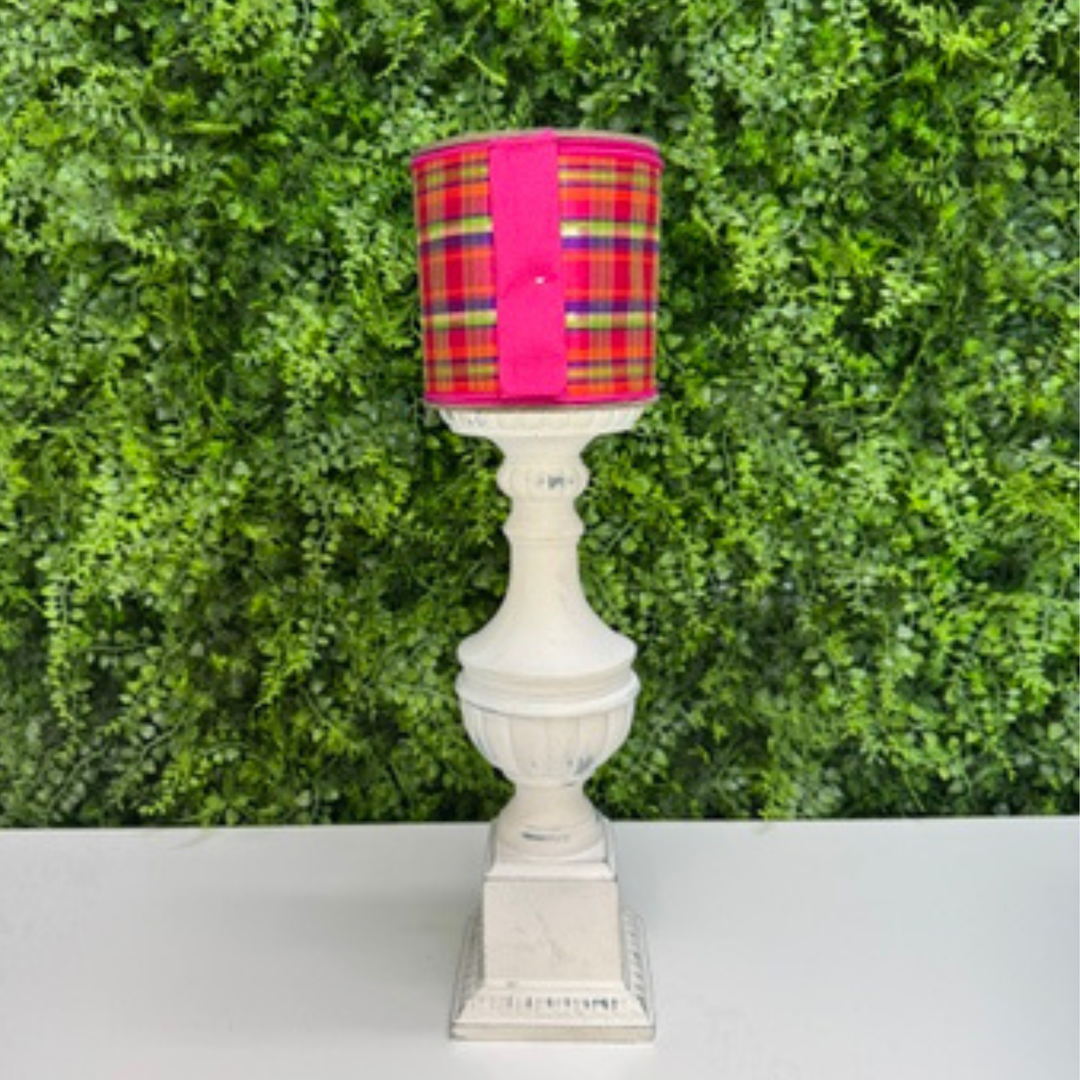 Farrisilk Plaid wired ribbon on a green leaf background