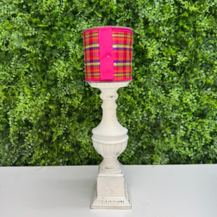 Farrisilk Plaid wired ribbon on a green leaf background