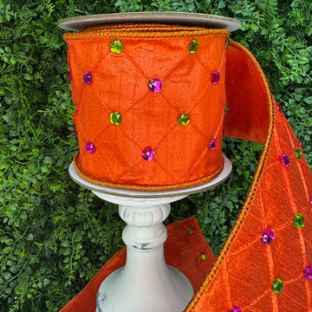 Farrisilk Jeweled orange wired ribbon with quilted texture and pink and green gem acccents. wired edge designer ribbon for Fall wreaths and Halloween decor.