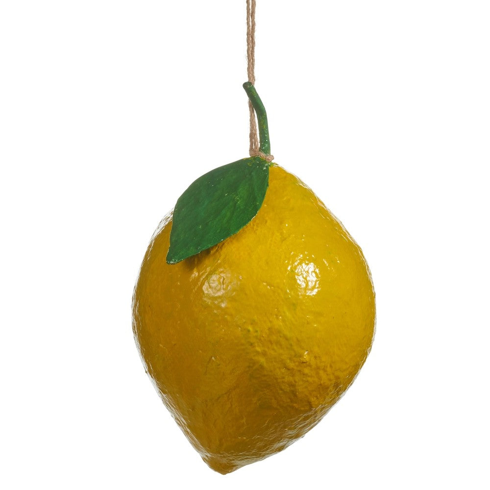 Decorative lemon with a green leaf on a white background