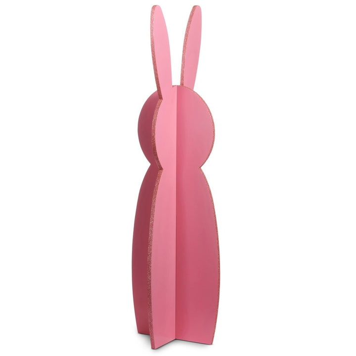 Pink rabbit-shaped bookend on a white background
