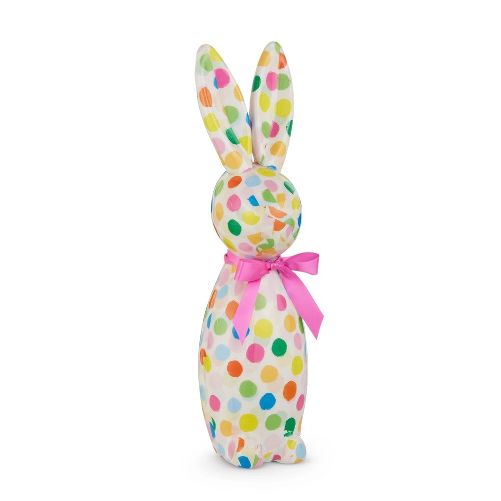 Bunny with colorful polka dot pattern and pink bow on a white background