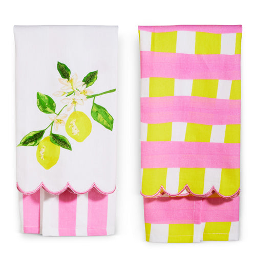 Two decorative towels, one with a lemon design and the other with pink and green stripes.