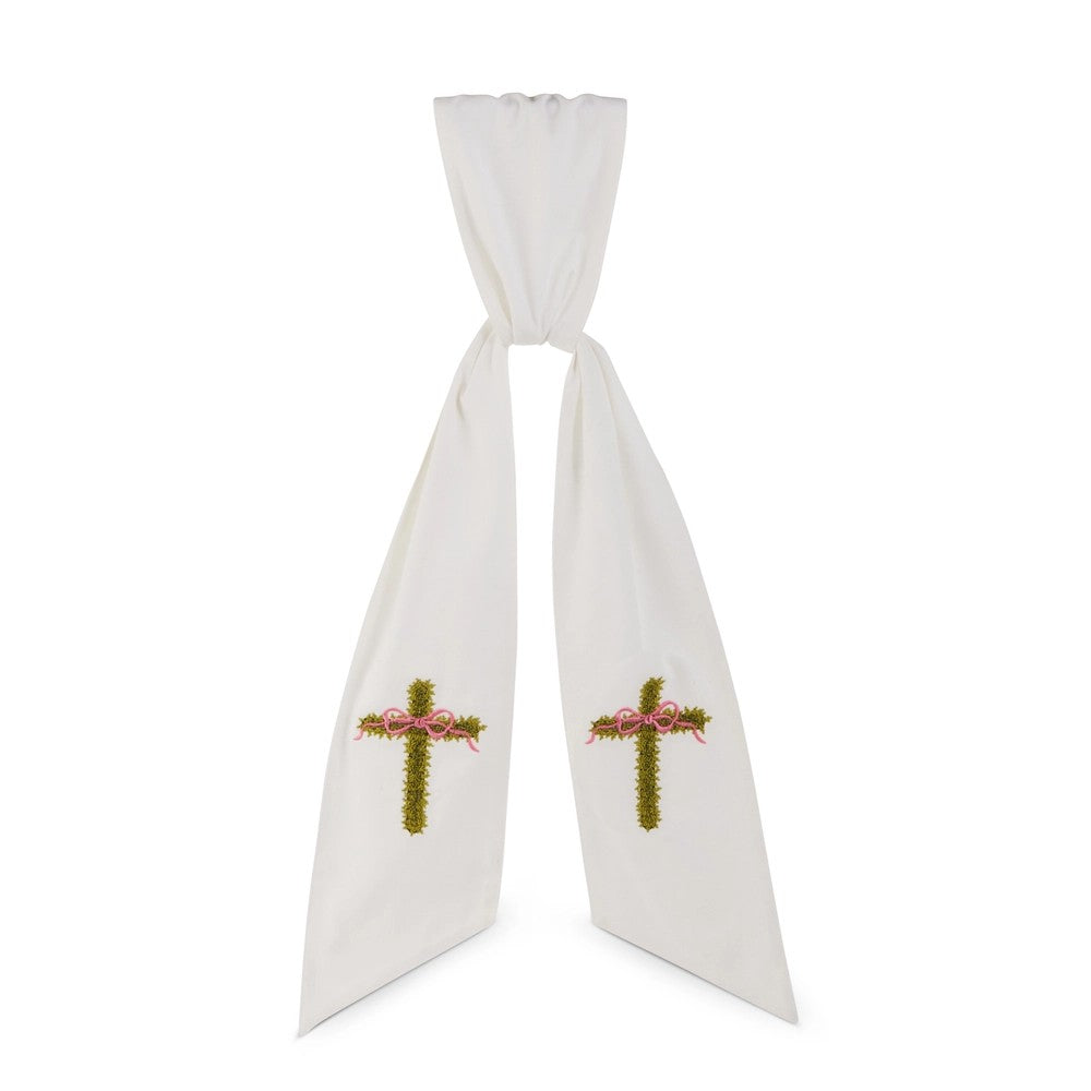 White tie sash with embroidered crosses on a white background