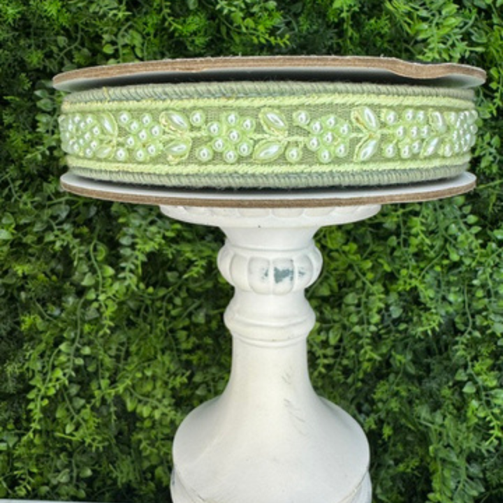 Exclusive Farrisilk sage green wired ribbon with faux pearl detailing and wired edges.  Perfect for luxury bows, wreaths, floral arrangements, wedding decor and elegant home decoraitng projects.