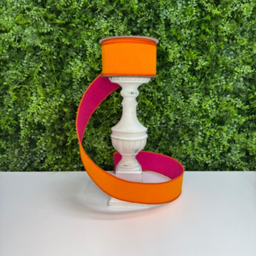 Picture of Farrisilk luxury two-tone dupioni wired ribbon in vibrant orange with hot pink reverse side, ideal for wreath bows, floral arrangements, and DIY decorating