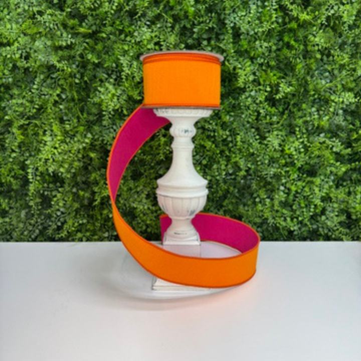 Picture of Farrisilk luxury two-tone dupioni wired ribbon in vibrant orange with hot pink reverse side, ideal for wreath bows, floral arrangements, and DIY decorating