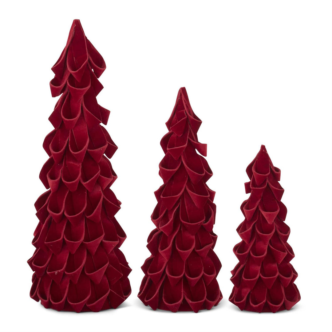 Three red, textured Christmas tree decorations on a white background