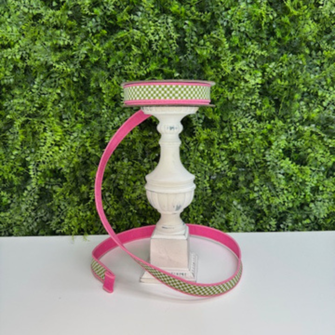 Farrisilk green and white checked ribbon with pink back and edging against a green leafy background
