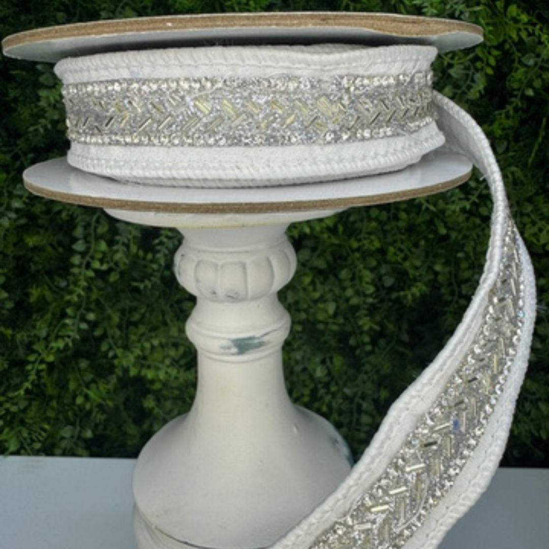 Farrisilk 1 inch white structured wired ribbon with silver baguette jewel embellishments, perfect for designer bows, wedding décor, Christmas decorating, floral arrangements and luxury gift wrapping.