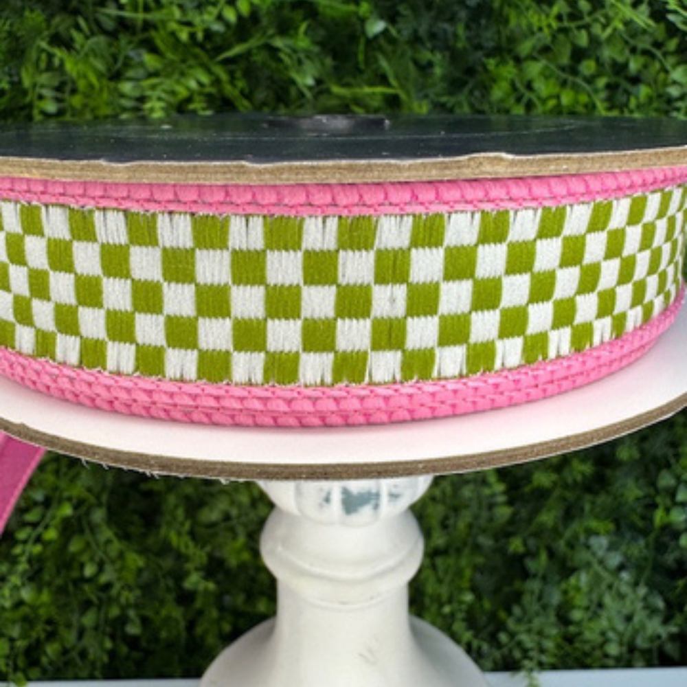 Farrisilk Green and white checkered ribbon with pink border on a white stand against a green background