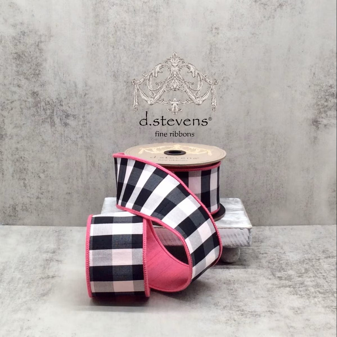 Spool of black and white checkered ribbon with pink border on a gray surface, featuring 'd.stevens' branding.