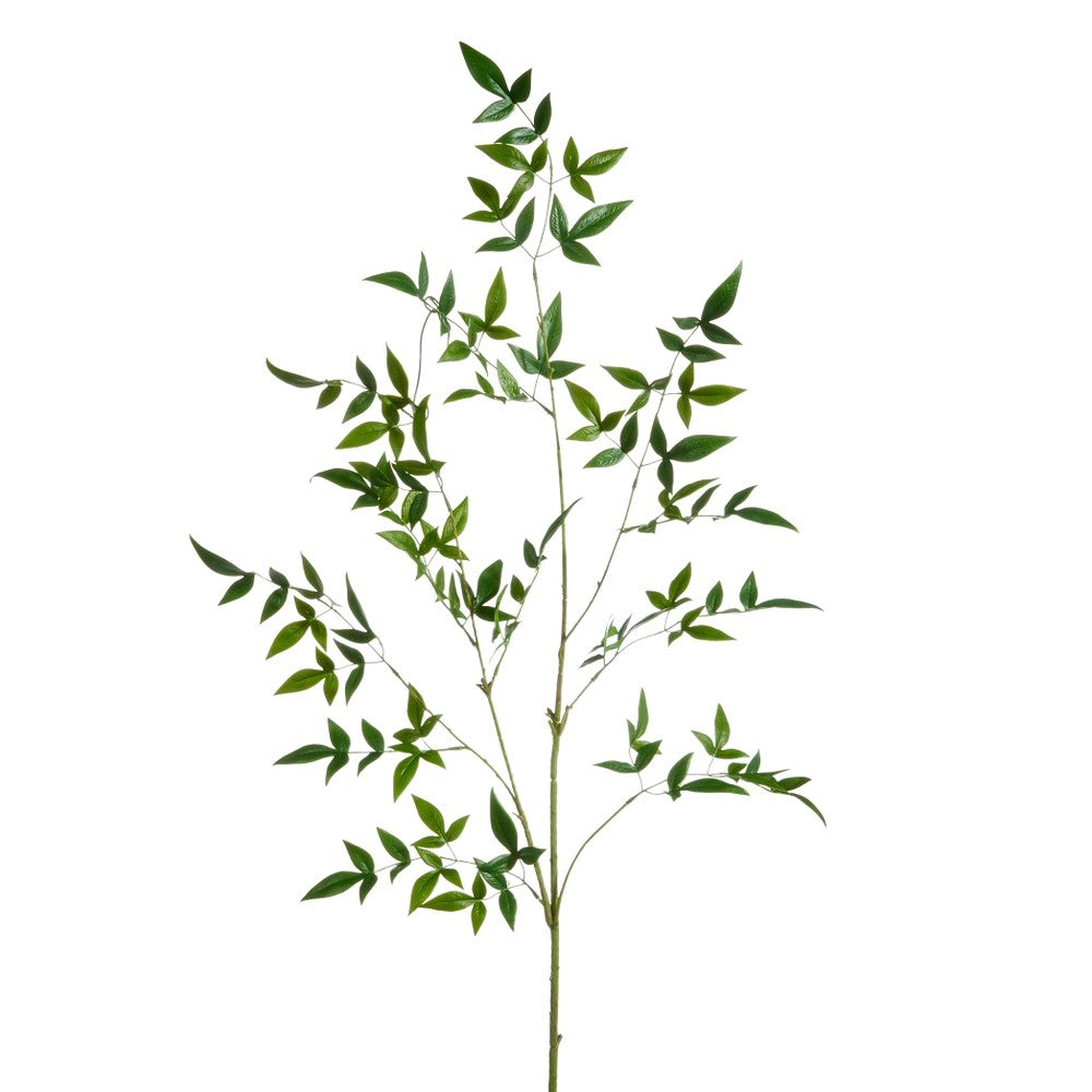 Artificial bamboo branch with green leaves on a white background