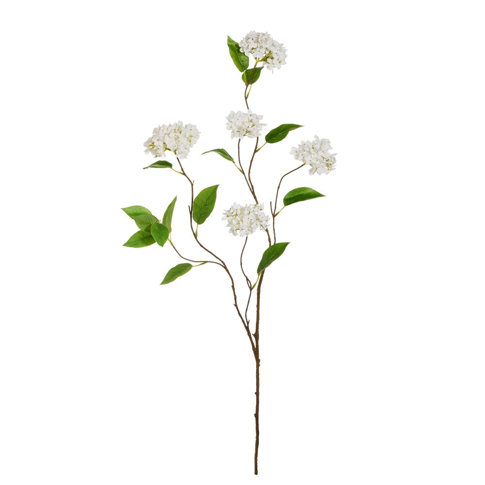 Artificial flower branch with white flowers and green leaves on a white background