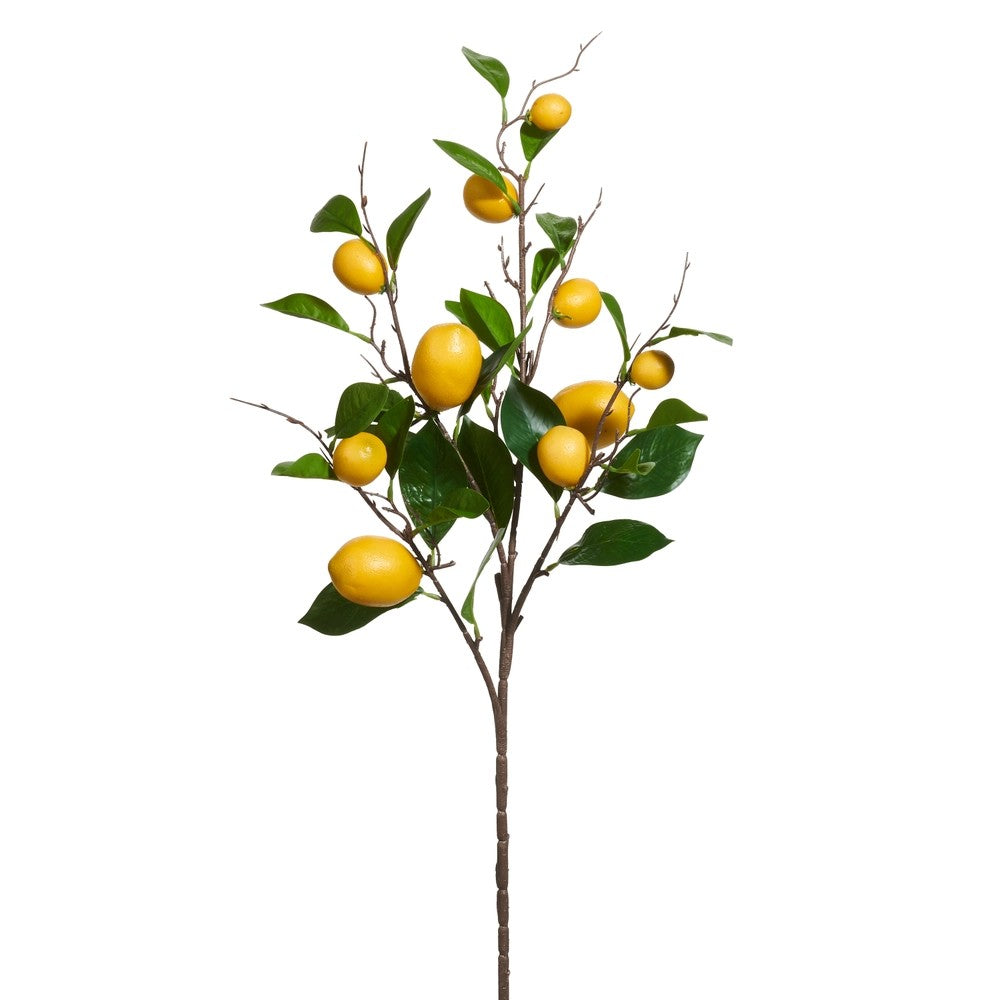 Artificial lemon branch with yellow lemons and green leaves on a white background