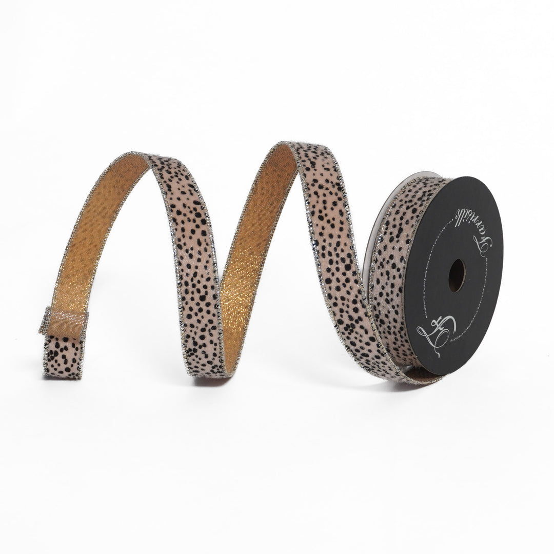 Spotted ribbon on a spool with a visible brand logo on a white background