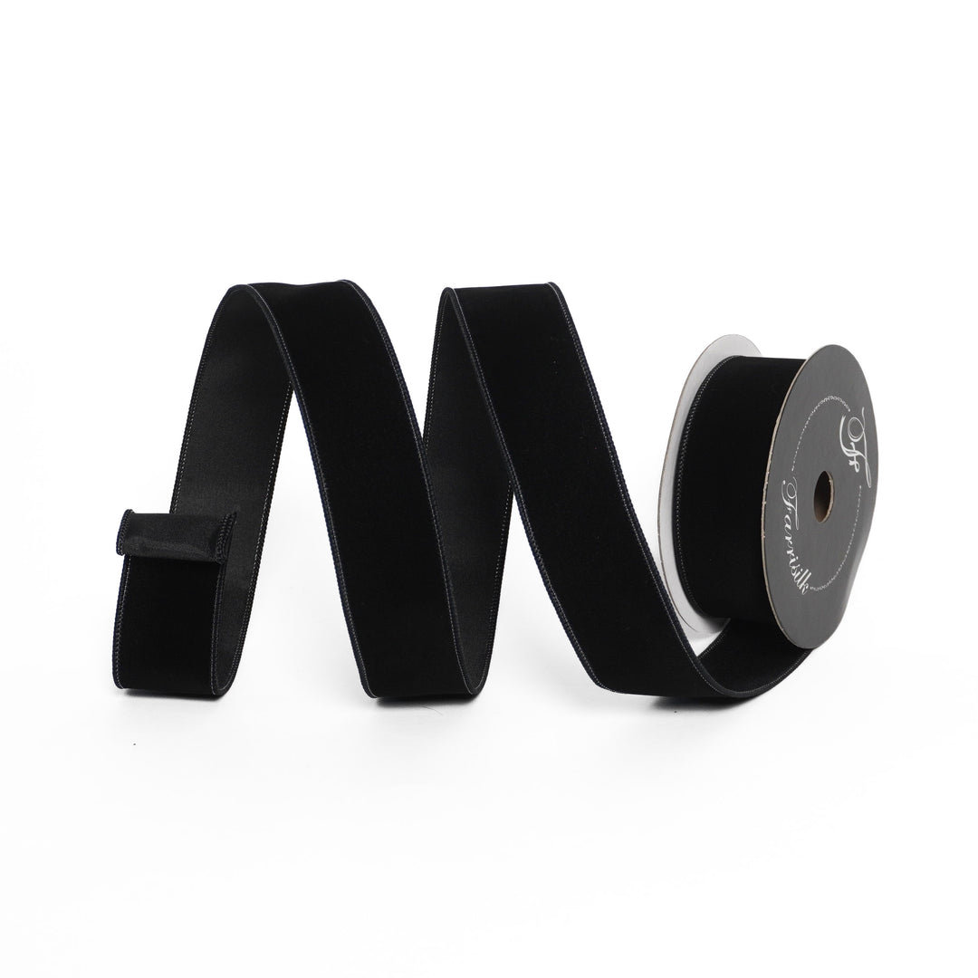 Black ribbon with a spool on a white background