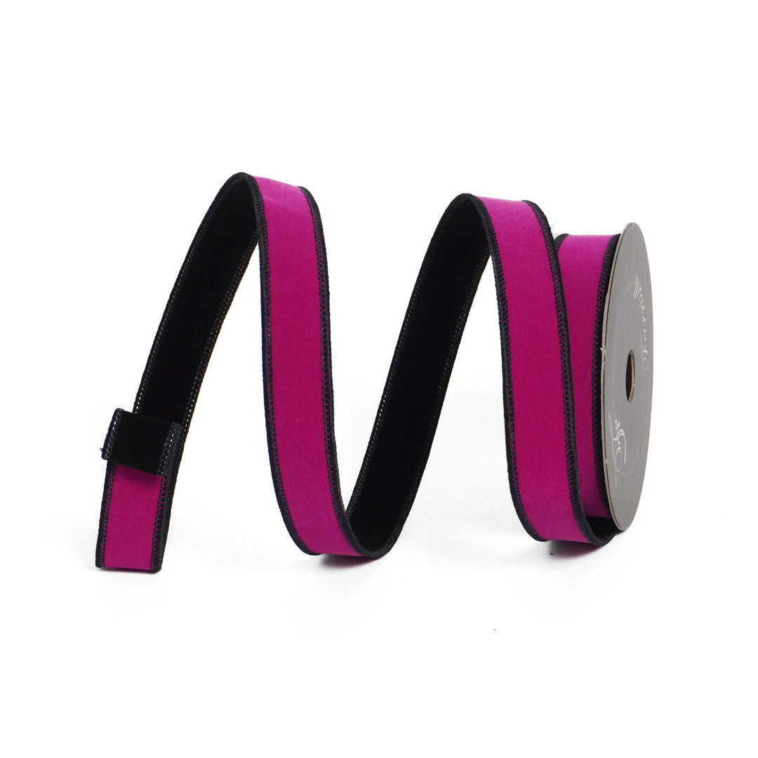 Roll of pink ribbon with black edge on a white background