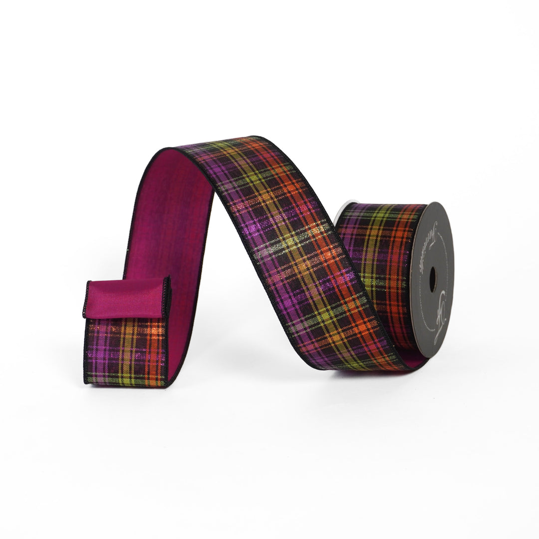 Plaid ribbon on a spool with a purple edge on a white background