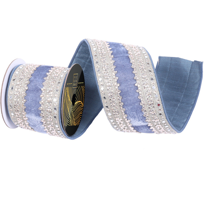 Vickerman 4 inch denim blue velvet wired ribbon with sparkling crystal-inspired jewel trim, reflective mirror accents, metallic embroidery, and wired edges for luxury bows, wreaths, Christmas trees, garlands, floral arrangements, and elegant holiday décor.