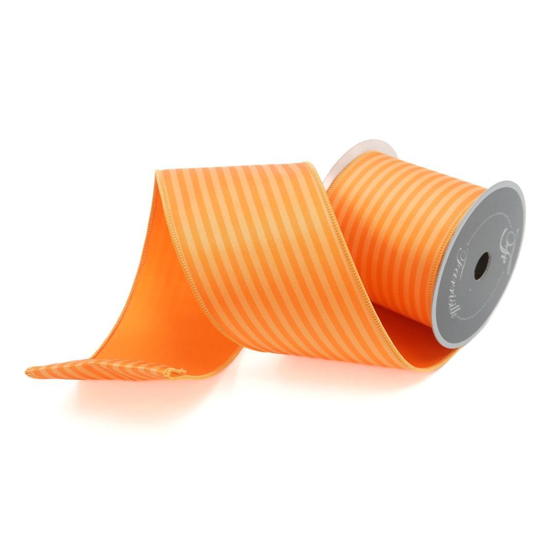 Orange ribbon with a spool on a white background