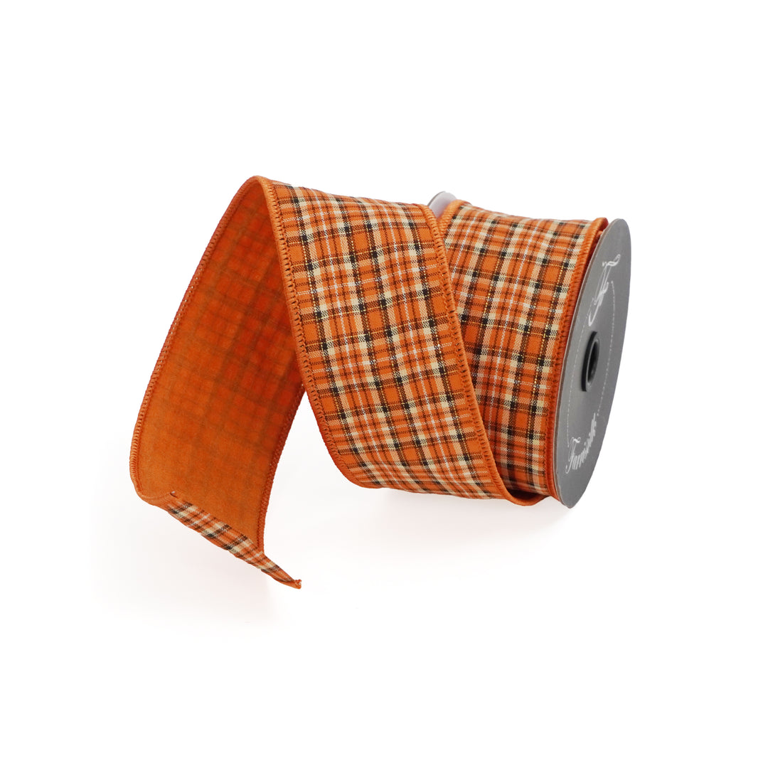 Spool of orange plaid ribbon on a white background