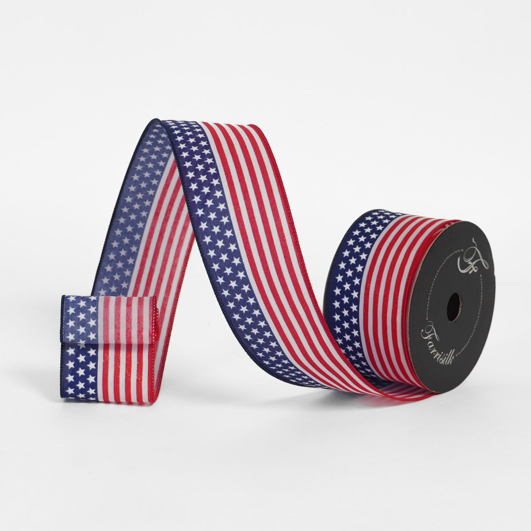 American flag patterned ribbon on a spool with a white background