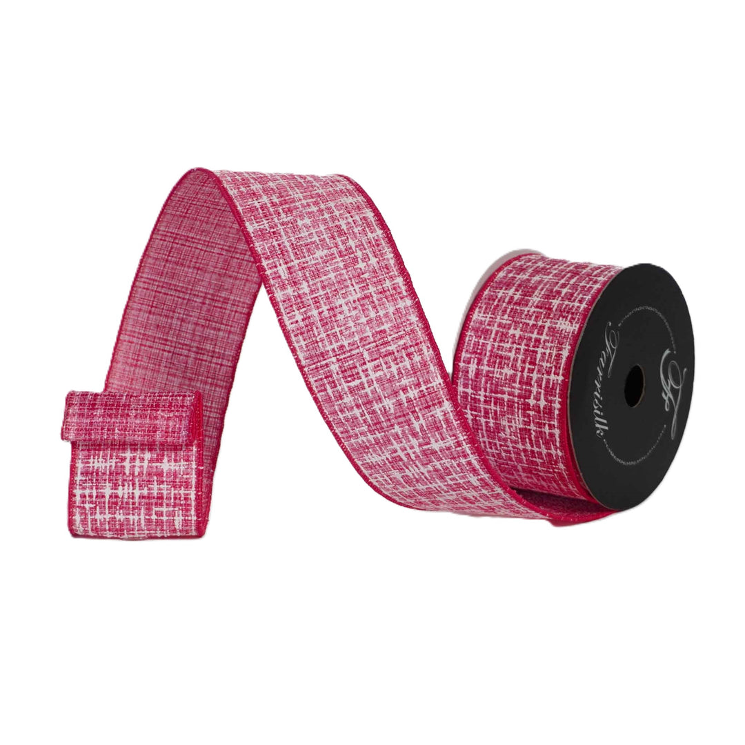 Roll of pink ribbon with a textured pattern on a white background