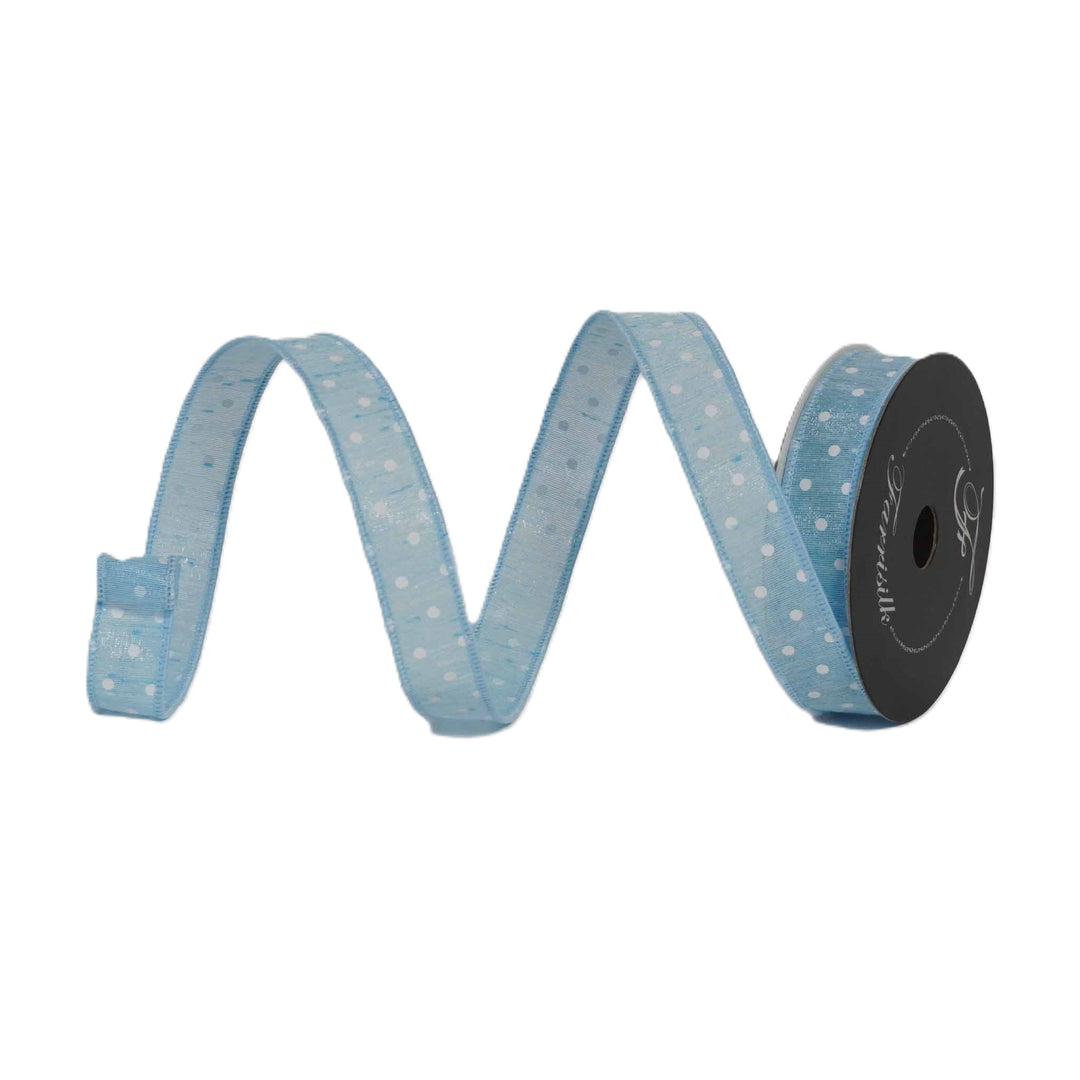 Spool of light blue ribbon with white polka dots on a white background