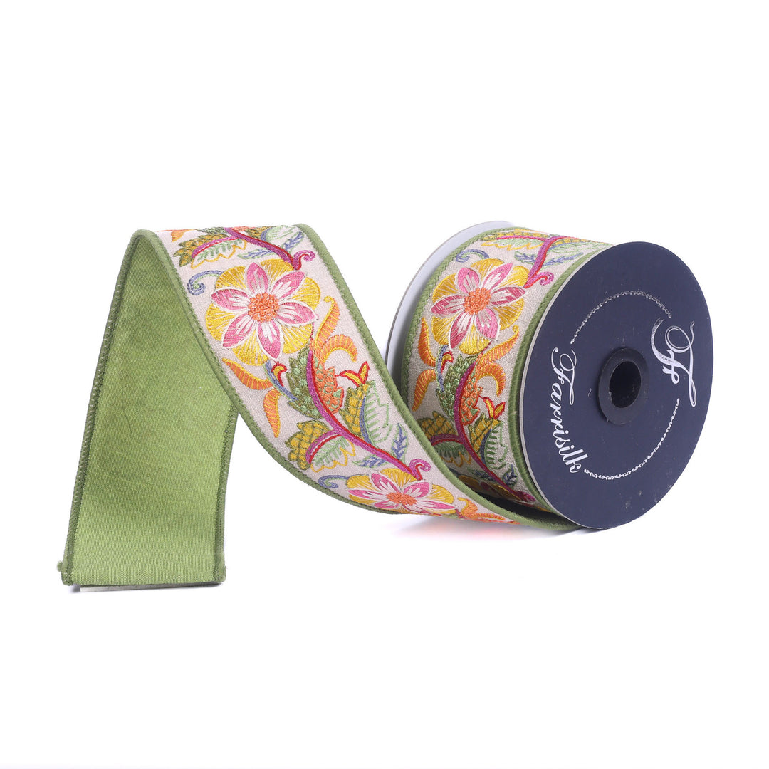 Spool of Farrisilk embroidered floral ribbon with a green edge and back on a white background