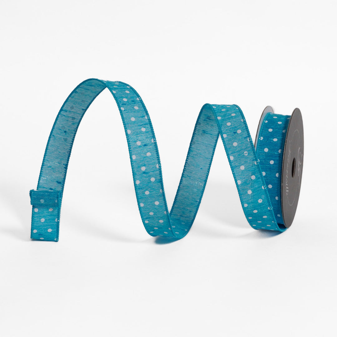 Blue ribbon with white polka dots on a white background