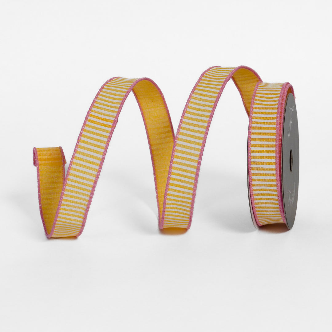 Striped ribbon with yellow and pink pattern on a white background
