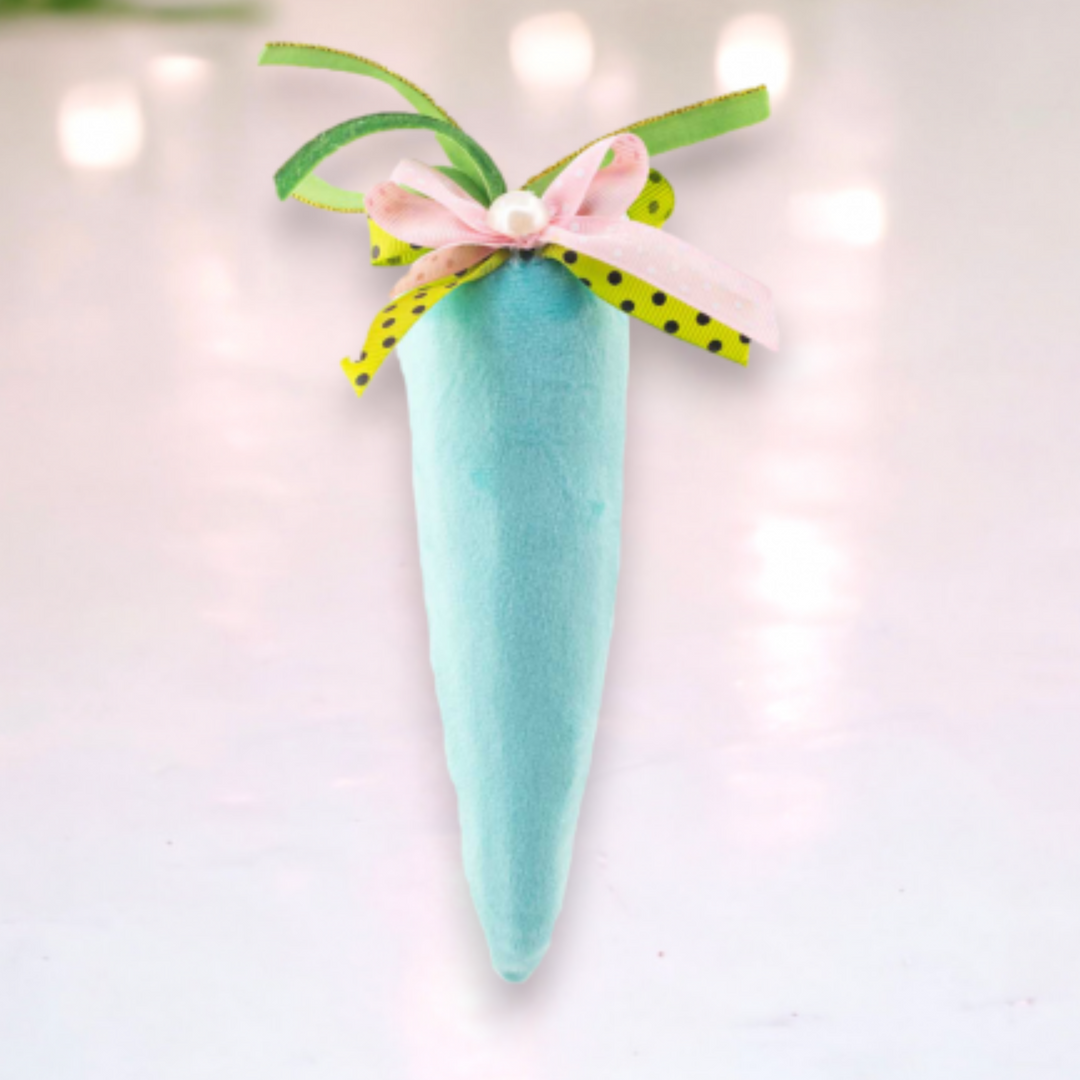 a phot of a teal blue velour carrot with ribbons and pearl