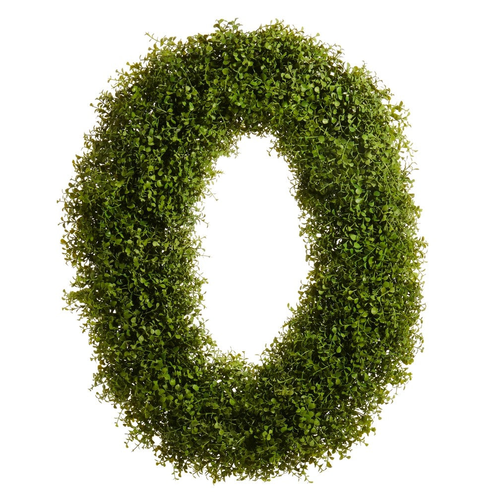 Green artificial wreath on a white background